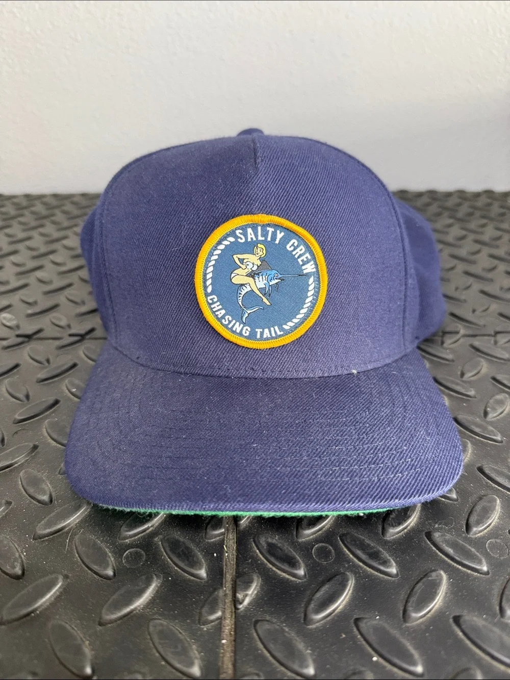 Salty Crew Navy Cap with Yellow-Trim Chasing Tail Patch